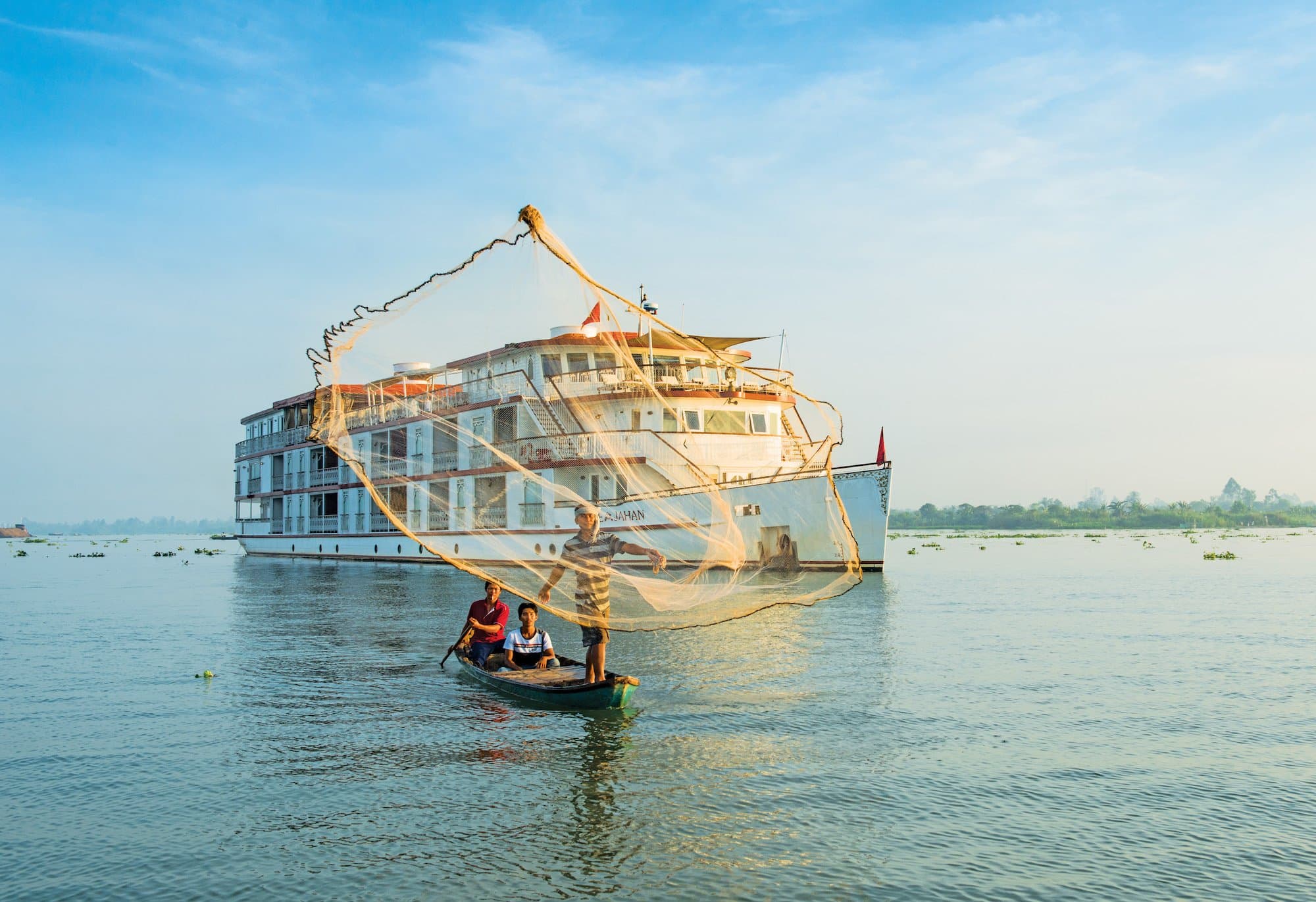 Hero Image Jahan with fisherman on Mekong.jpg